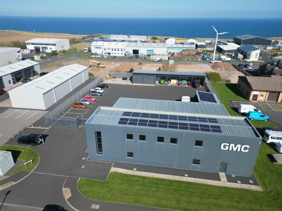 Aerial view of the GMC headquarters at Ramparts Business Park with solar panels on the roof