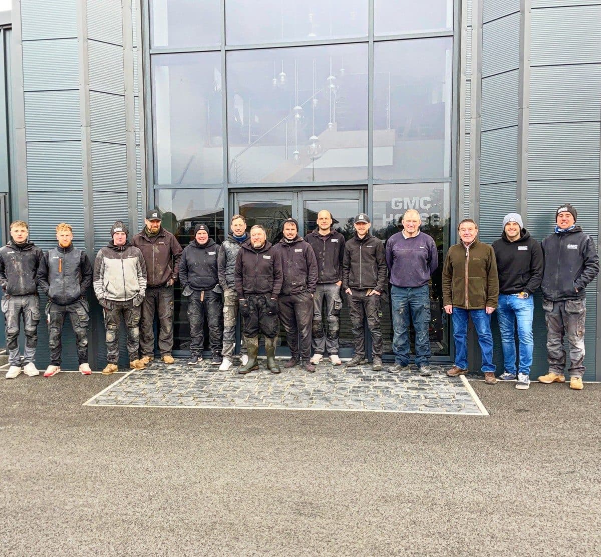 The GMC installation team standing outside GMC HQ in Berwick-upon-Tweed
